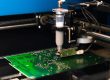 Dispensing solder paste onto a circuit board, a prime example of rheology’s role in electronics manufacturing.