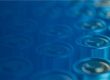Close-up of blue cylindrical battery cells arranged in rows